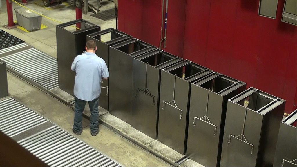 Employee working on filling cabinets