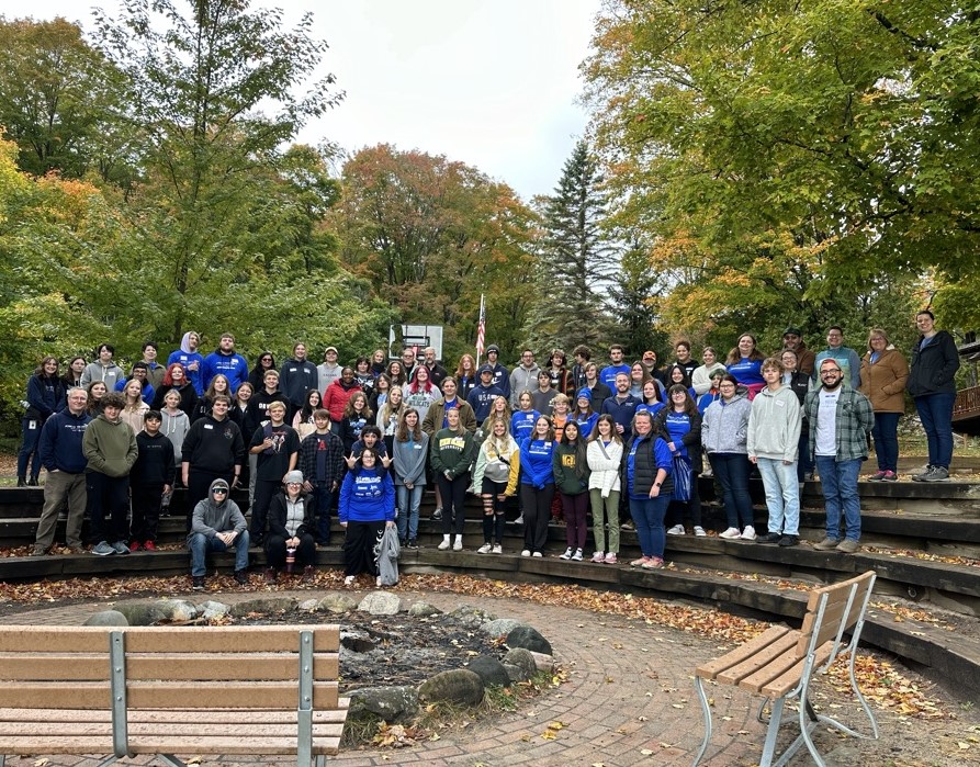 Students standing on steps in amphitheater 